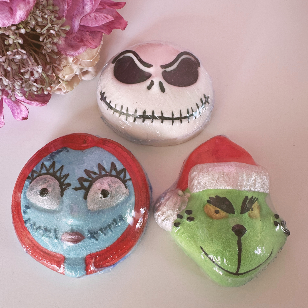 Christmas Character Bath Bombs by Smelts Aromas – festive handmade bath bombs shaped as The Grinch, Jack Skellington, and Sally, displayed with Christmas décor and bright colours.