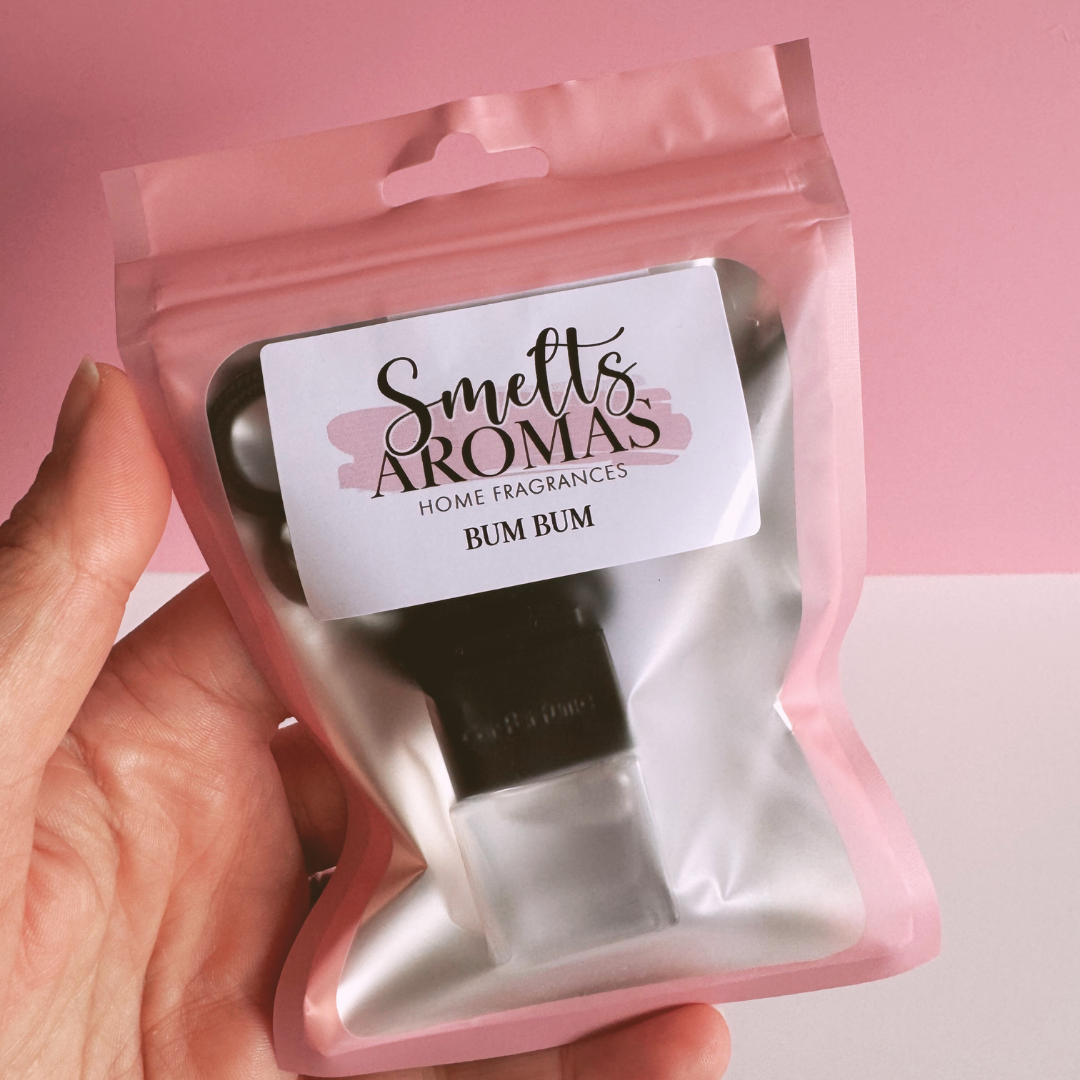 Bum Bum Car Perfume by Smelts Aromas – handmade fruity and floral tropical car fragrance with coconut, peach, vanilla, and musk.