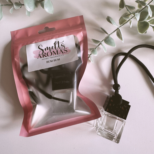 Bum Bum Car Perfume by Smelts Aromas – handmade fruity and floral tropical car fragrance with coconut, peach, vanilla, and musk.