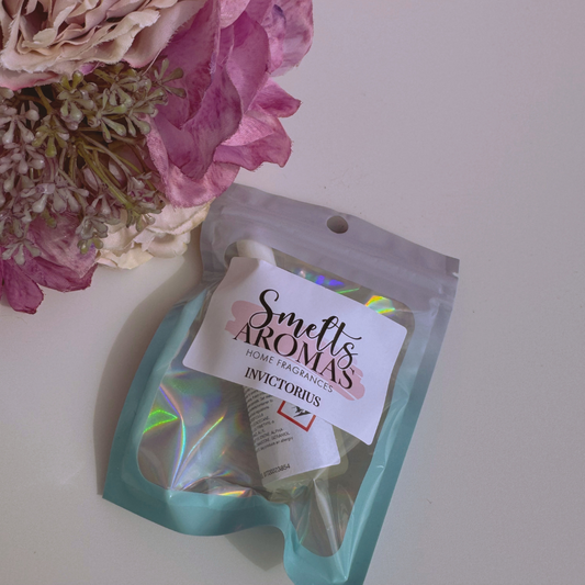 Invictorius Fragrance Oil Mist Diffuser Oil from Smelts Aromas with a flower in the background