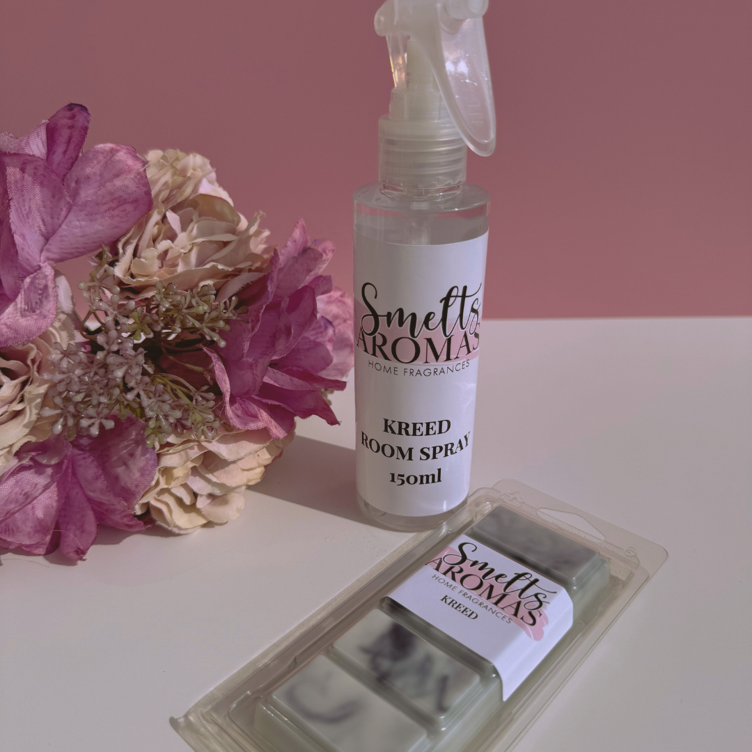 Smelts Aromas Kreed room spray and wax melts bundle deal with a flower in the background with a pink background