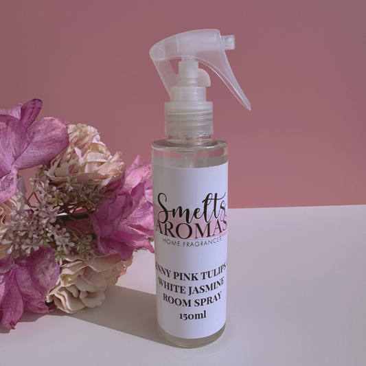 Lenny Pink Tulips & White Jasmine room spray bottle from Smelts Aromas with flowers on a pink background